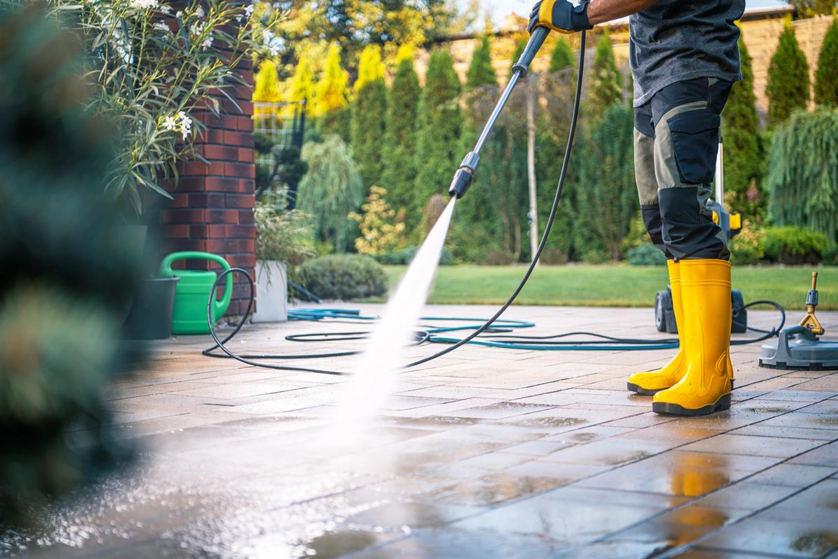 A patio being pressure washed